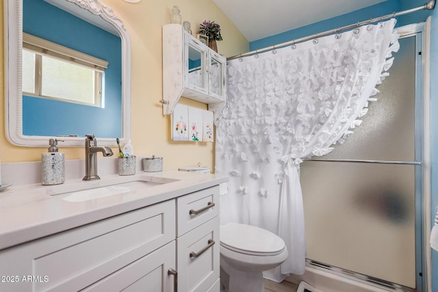 full bathroom with a baseboard radiator, a shower with shower curtain, vanity, and toilet