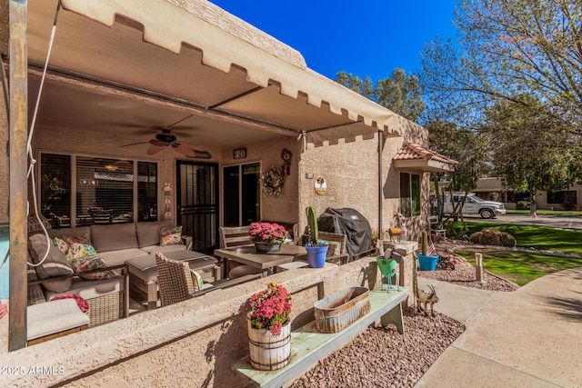 view of patio featuring outdoor lounge area, grilling area, and a ceiling fan