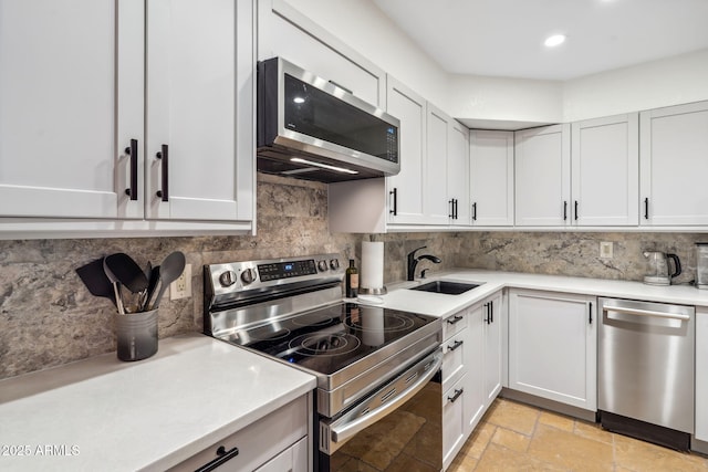 8787 E Mountain View Rd Unit 1100, Scottsdale, AZ 85258 - kitchen featuring appliances with stainless steel finishes, a sink, light countertops, tasteful backsplash, and recessed lighting