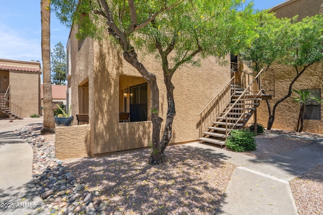 8787 E Mountain View Rd Unit 1100, Scottsdale, AZ 85258 - view of front of house featuring stairway and stucco siding