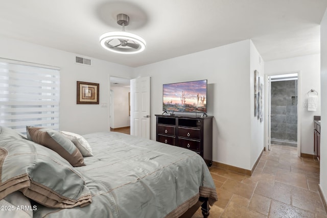 8787 E Mountain View Rd Unit 1100, Scottsdale, AZ 85258 - bedroom with stone tile floors and baseboards