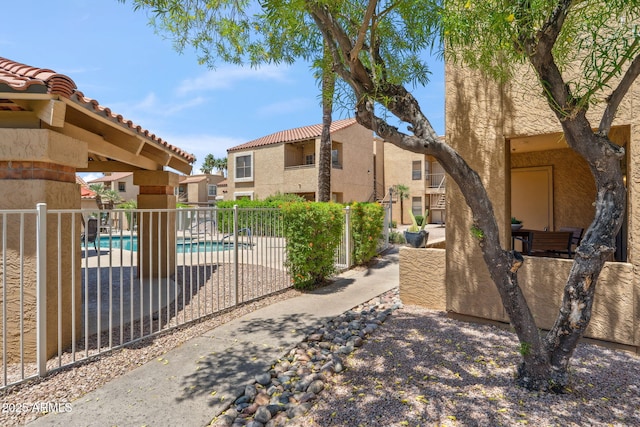 8787 E Mountain View Rd Unit 1100, Scottsdale, AZ 85258 - view of property's community featuring a swimming pool and a patio area