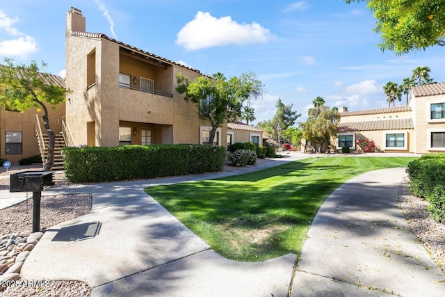 8787 E Mountain View Rd Unit 1100, Scottsdale, AZ 85258 - view of community with stairway and a lawn