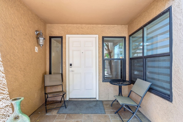8787 E Mountain View Rd Unit 1100, Scottsdale, AZ 85258 - doorway to property featuring stucco siding