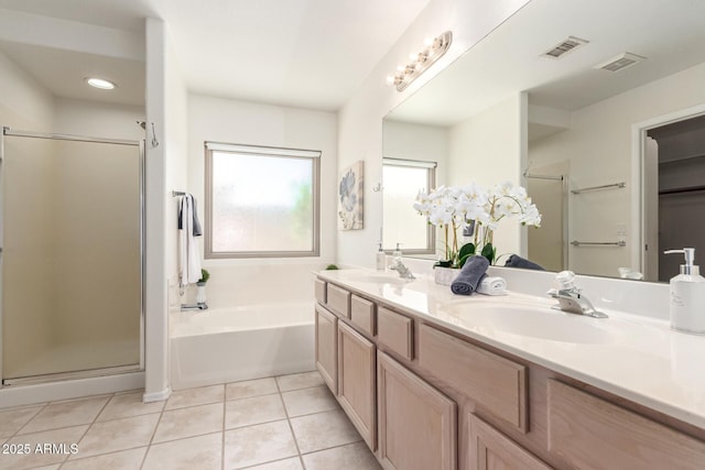 full bathroom with a stall shower, a garden tub, tile patterned floors, double vanity, and recessed lighting
