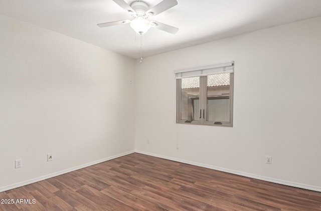 unfurnished room with ceiling fan, wood finished floors, and baseboards
