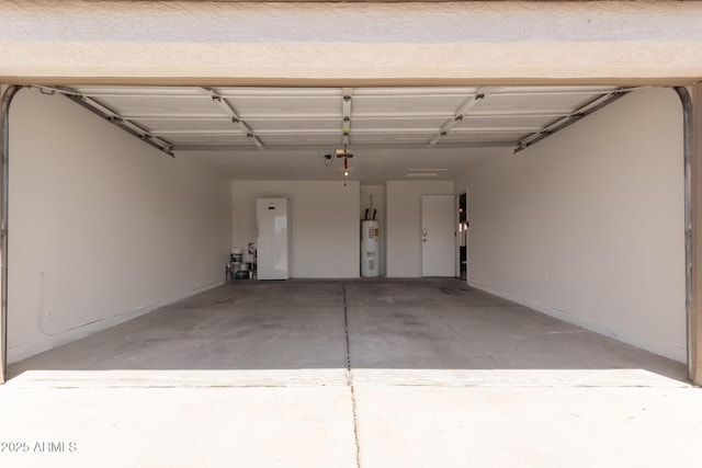 garage featuring water heater and a garage door opener