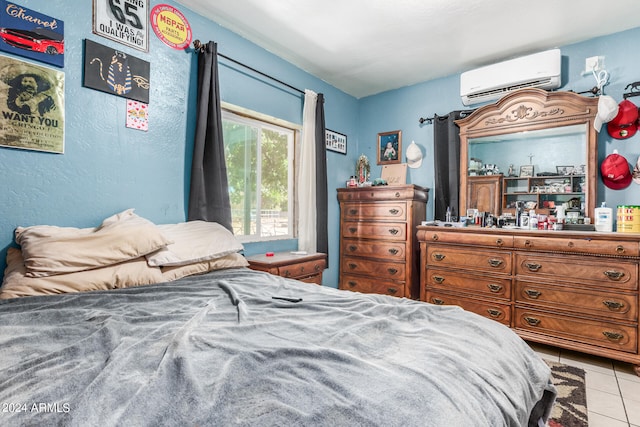 tiled bedroom featuring a wall unit AC