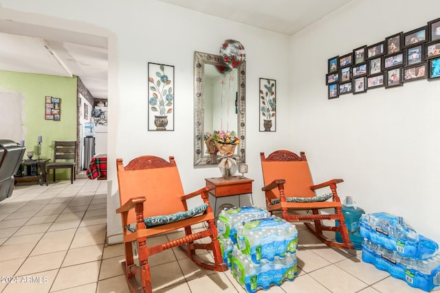 sitting room featuring light tile floors