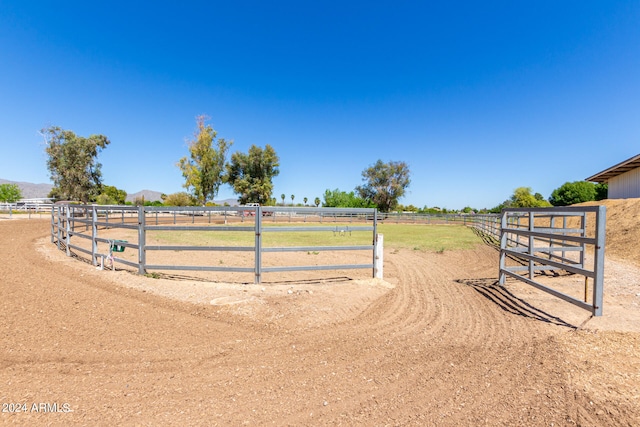 view of yard with a rural view