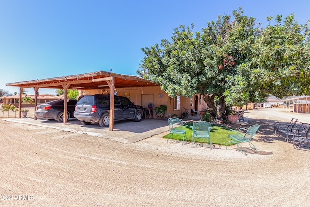 view of parking / parking lot with a carport