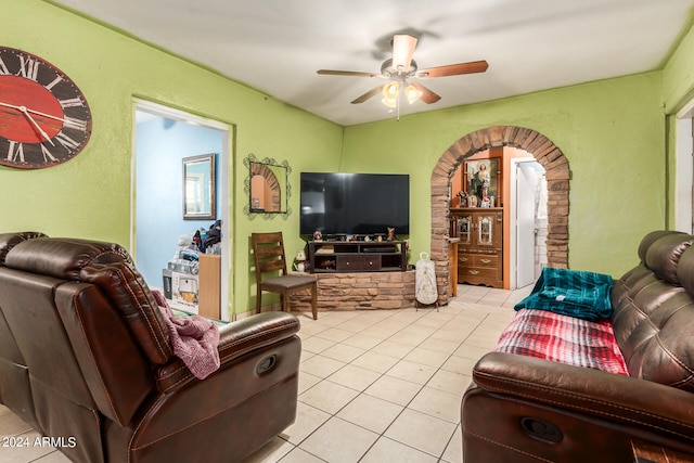 tiled living room featuring ceiling fan