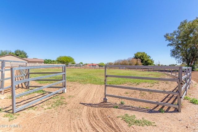 view of yard with a rural view