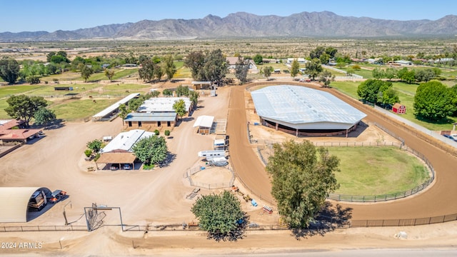 birds eye view of property with a mountain view