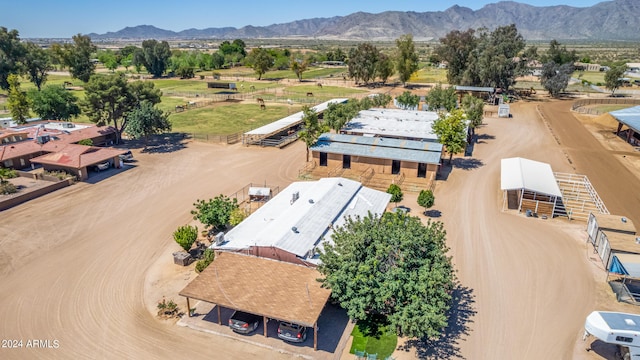 birds eye view of property with a mountain view