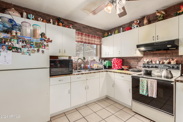 kitchen with white cabinets, white fridge, sink, electric range, and ceiling fan