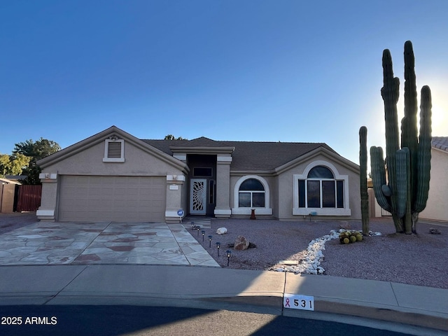 single story home featuring a garage