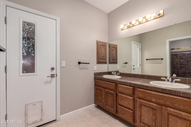 14602 N 63rd Pl, Scottsdale, AZ 85254 - bathroom with double vanity, baseboards, and tile patterned floors