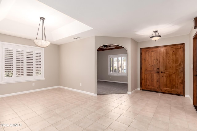 14602 N 63rd Pl, Scottsdale, AZ 85254 - foyer entrance with arched walkways, baseboards, and light tile patterned floors