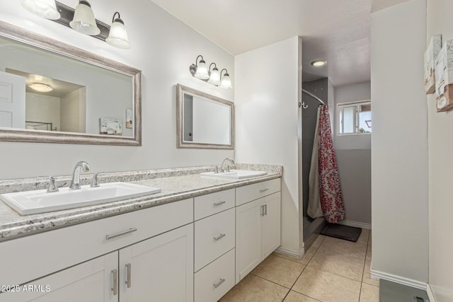 1235 E Dover St, Mesa, AZ 85203 - full bathroom with double vanity, tile patterned floors, baseboards, and a shower with curtain
