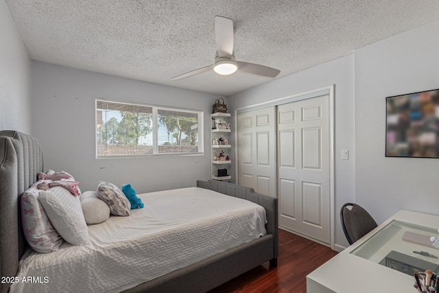 1235 E Dover St, Mesa, AZ 85203 - bedroom featuring dark wood-style flooring, a textured ceiling, a closet, and ceiling fan
