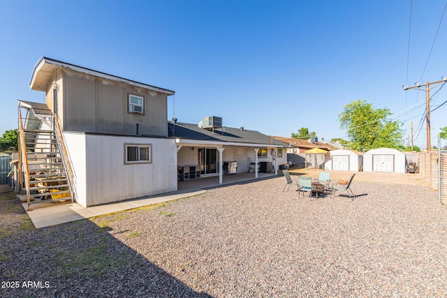 1235 E Dover St, Mesa, AZ 85203 - rear view of property with stairs, a patio area, and central AC unit
