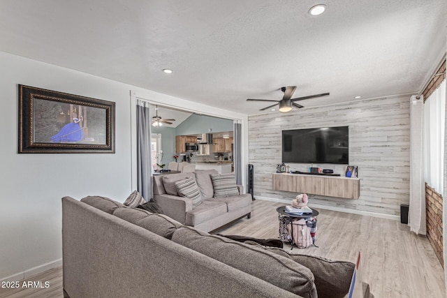 1235 E Dover St, Mesa, AZ 85203 - living room featuring ceiling fan, baseboards, wood finished floors, a textured ceiling, and recessed lighting