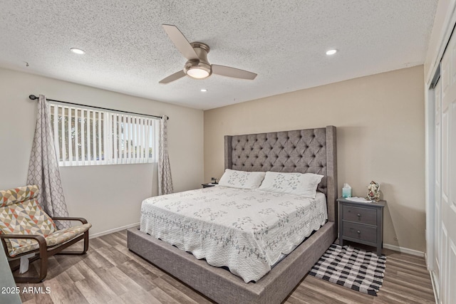 1235 E Dover St, Mesa, AZ 85203 - bedroom featuring a closet, wood finished floors, recessed lighting, baseboards, and a textured ceiling