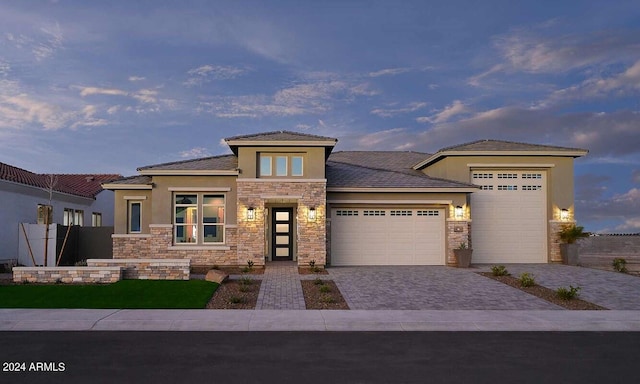 prairie-style home featuring a garage