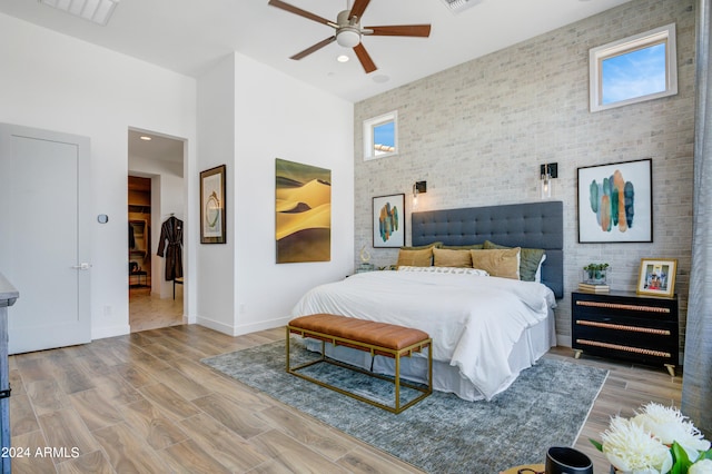 bedroom featuring light wood-type flooring and ceiling fan