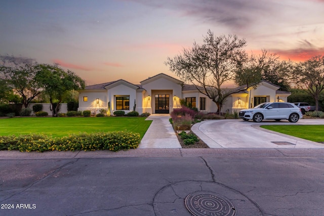 view of front of house with a yard