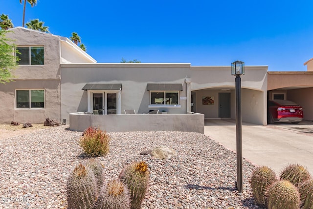 7736 E Rancho Vista Dr, Scottsdale, AZ 85251 - pueblo-style house with stucco siding
