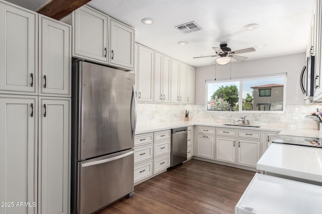 7736 E Rancho Vista Dr, Scottsdale, AZ 85251 - kitchen with appliances with stainless steel finishes, a sink, backsplash, and ceiling fan