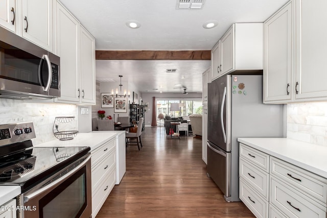 7736 E Rancho Vista Dr, Scottsdale, AZ 85251 - kitchen with stainless steel appliances, a chandelier, light countertops, and recessed lighting