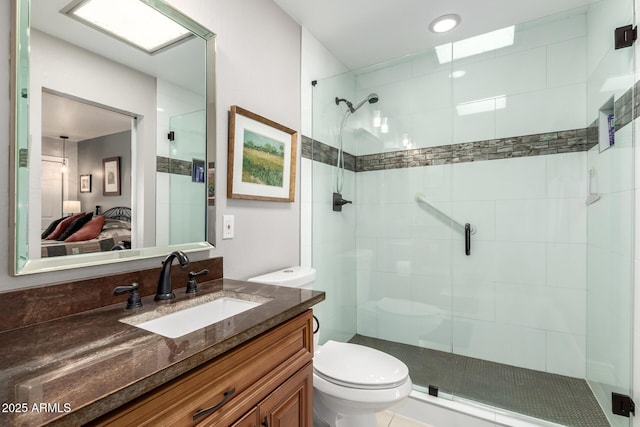7736 E Rancho Vista Dr, Scottsdale, AZ 85251 - bathroom featuring toilet, connected bathroom, a stall shower, and vanity