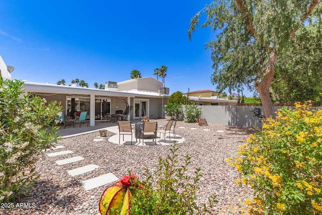 7736 E Rancho Vista Dr, Scottsdale, AZ 85251 - back of property with fence, a patio area, and stucco siding