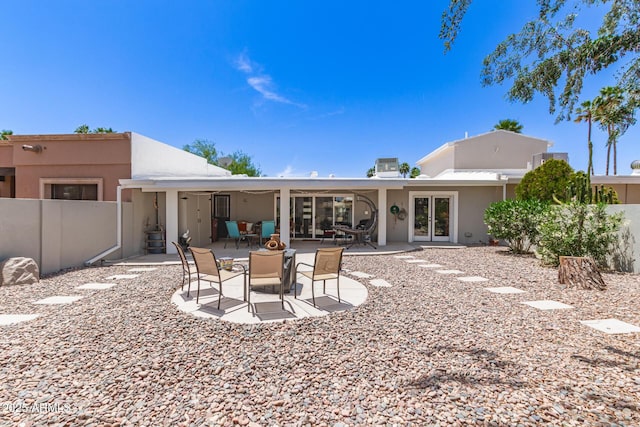 7736 E Rancho Vista Dr, Scottsdale, AZ 85251 - rear view of house with fence, stucco siding, and a patio