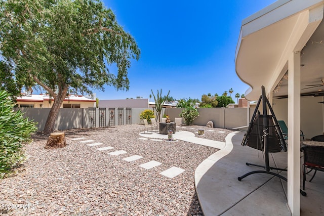 7736 E Rancho Vista Dr, Scottsdale, AZ 85251 - fenced backyard featuring a patio area and ceiling fan