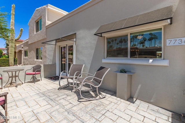 7736 E Rancho Vista Dr, Scottsdale, AZ 85251 - view of patio featuring french doors