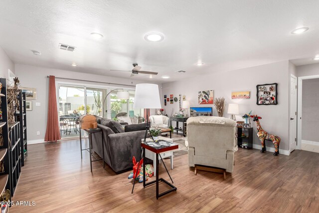 7736 E Rancho Vista Dr, Scottsdale, AZ 85251 - living room with wood finished floors, baseboards, a ceiling fan, and recessed lighting