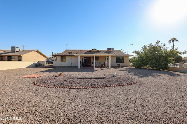 back of house with a patio