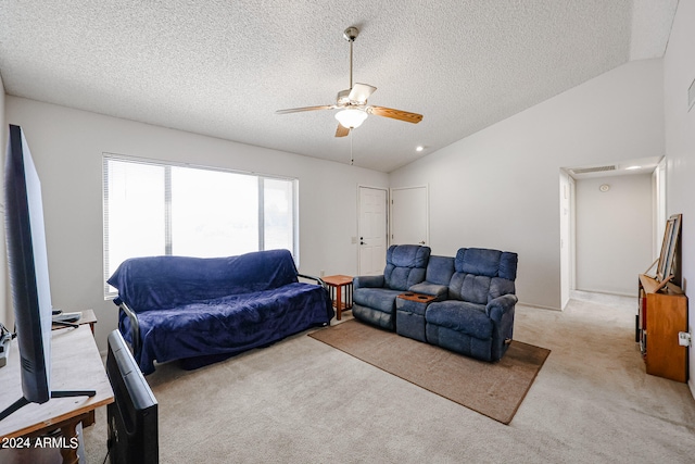 carpeted living room with lofted ceiling, ceiling fan, and a textured ceiling