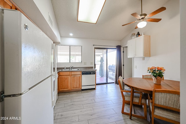 kitchen with ceiling fan, lofted ceiling, sink, white appliances, and light hardwood / wood-style flooring