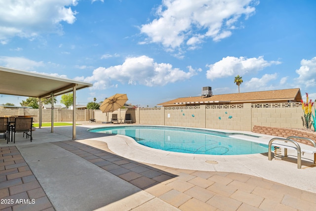 view of pool with outdoor dining space, a patio area, a fenced backyard, and a fenced in pool