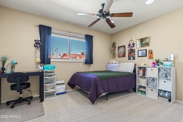 bedroom with carpet floors, ceiling fan, and baseboards