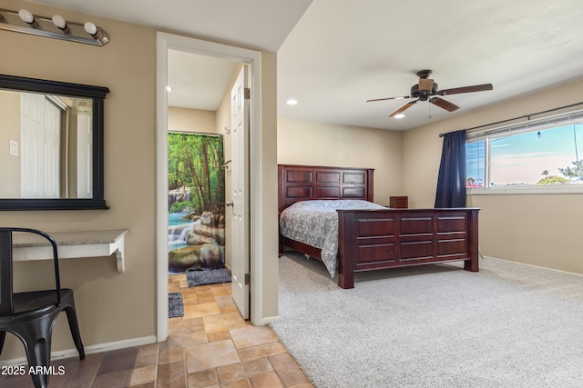 bedroom with ceiling fan, recessed lighting, light colored carpet, baseboards, and stone finish floor