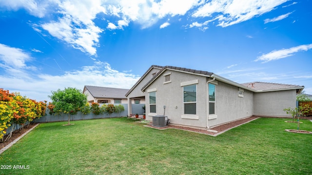 37820 W San Sisto Ave, Maricopa, AZ 85138 - rear view of property featuring a fenced backyard, a yard, a tiled roof, and stucco siding
