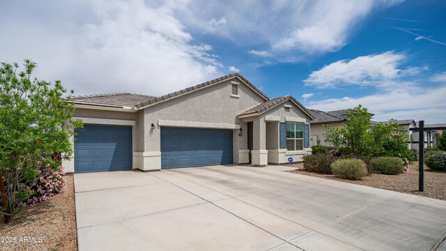 37820 W San Sisto Ave, Maricopa, AZ 85138 - ranch-style home with stucco siding, a tiled roof, driveway, and a garage