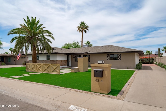 8214 E Northland Dr, Scottsdale, AZ 85251 - view of front of house featuring stucco siding and driveway