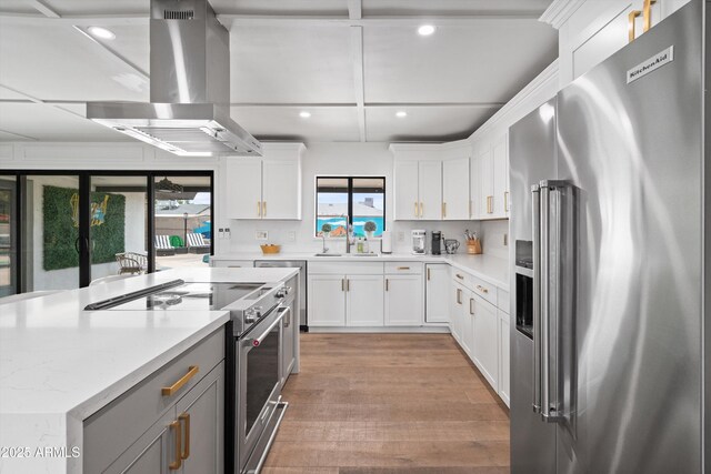 8214 E Northland Dr, Scottsdale, AZ 85251 - kitchen featuring high quality appliances, island range hood, a sink, recessed lighting, and light wood finished floors
